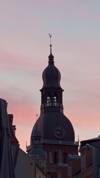 Decorative historic tower. Elegant baroque clock tower scene. Intricate ornate tower with sunset backdrop. Detailed architectural depiction of majestic tower during twilight hours