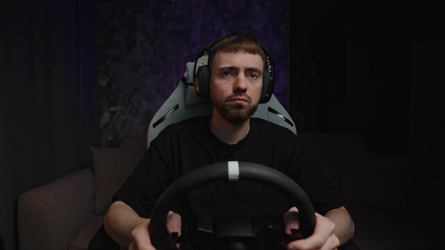 Startled White Man Reaching For Wheel, Tense Eyes And Quick Motion, Headset In Studio, Abrupt Reaction
