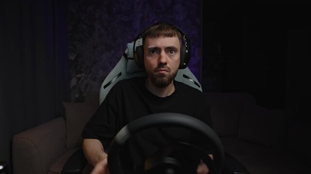 Determined White Man Gripping Wheel With Steady Stare, Intense Focus Under Purple Studio Light, Making