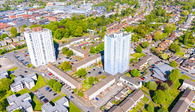 Aerial view of social council housing in a low cost area of the UK with two high rise tower blocks of flats