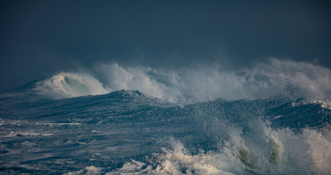 Huge waves crashing in ocean. Seascape environment background. Water texture with foam and splashes. Hawaiian surfing spots with nobody