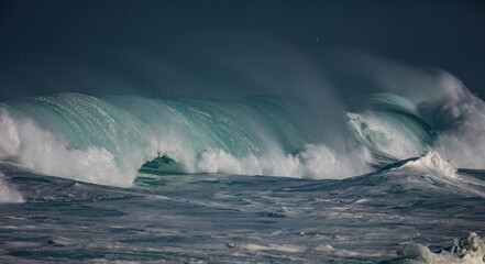 Huge waves crashing in ocean. Seascape environment background. Water texture with foam and splashes. Hawaiian surfing spots with nobody