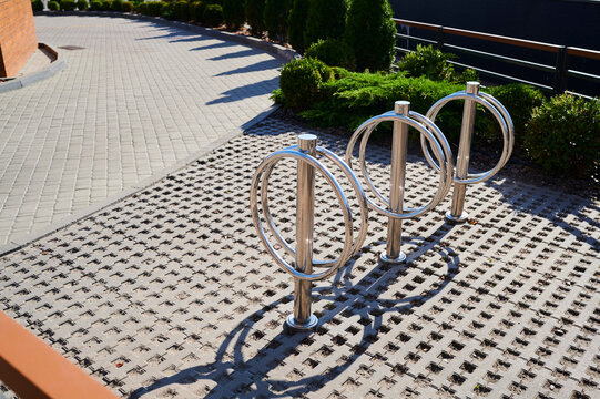 Unique bicycle parking design shines on a sunny day in a modern urban setting