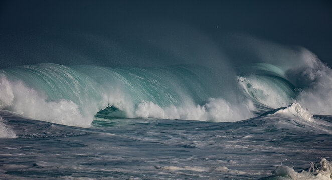 Huge waves crashing in ocean. Seascape environment background. Water texture with foam and splashes. Hawaiian surfing spots with nobody