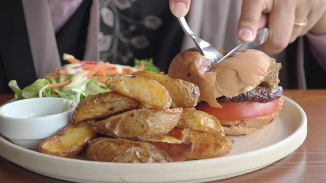 Burger, wedges, and salad at the restaurant