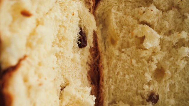 Close-up of panettone crumb texture with dried fruits. Traditional festive bakery. High quality 4k footage