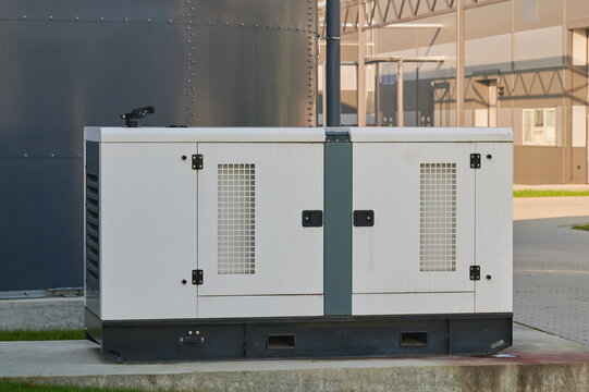 Power generator stands ready at industrial site