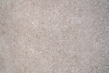 Fototapeta premium Beige stone texture with fine grain and subtle natural pattern, minimal neutral background for modern interior design and architectural surfaces