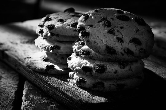 Shirini kishmishi biscuits stacked on a rustic wooden board