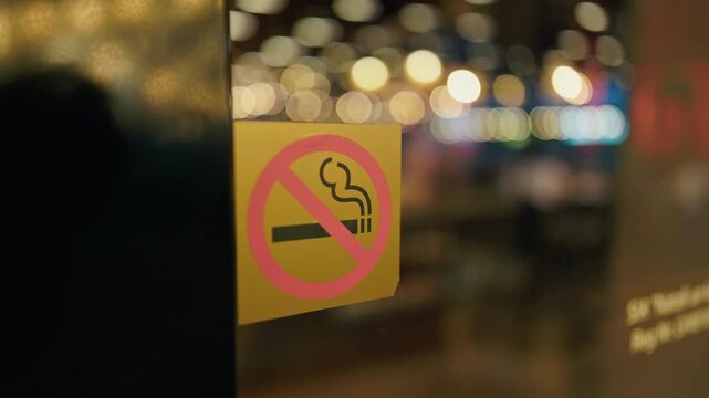 No smoking decal on door, cozy k slow motion frame shows warm golden lights, blurred silhouettes of patrons, glass reflections, inviting yet regulated hospitality atmosphere