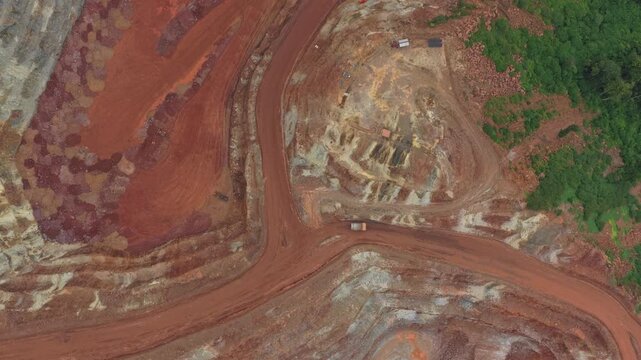 Aerial top down view of open pit bauxite mining quarry