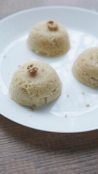 Close-up of traditional Turkish semolina halva with hazelnuts