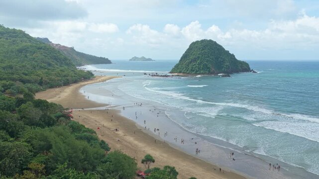 People enjoying a beautiful summer day on a tropical java beach