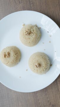 Close-up of traditional Turkish semolina halva with hazelnuts