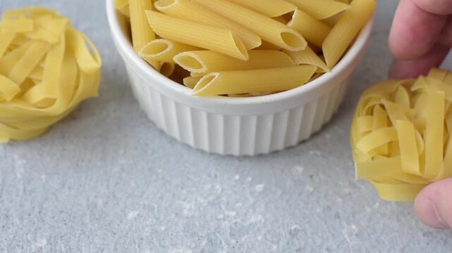 Italian uncooked dry penne regatta pasta with a gluten prohibition sign. The gluten prohibition sign as a background for your design.