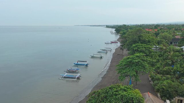 Lovina beach with traditional jukung boats for dolphin tours