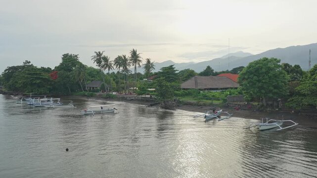 Traditional balinese jukung boats moored in lovina beach bay