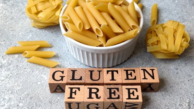 Italian uncooked, dry, gluten free penne regate pasta, ready for cooking. Dry, gluten free penne pasta as a food background for your design
