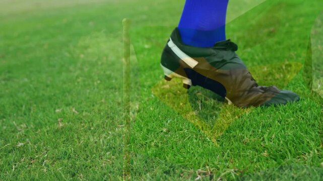 Soccer player approaching ball on turf touching with instep and passing yellow ring overlaying ball