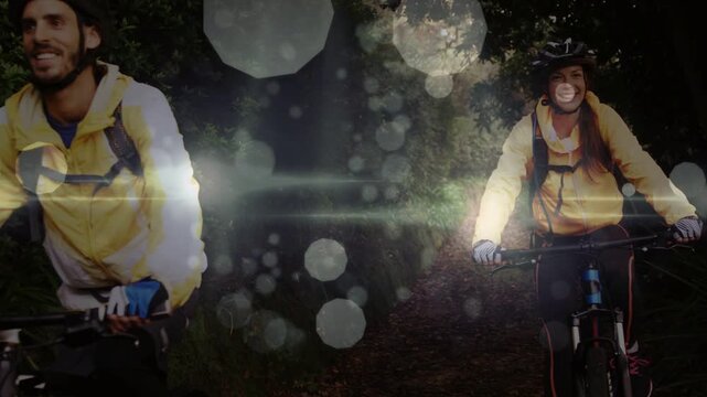 Outdoor couple cycling trail for leisure, camera shifting, bokeh streaks intensifying then easing