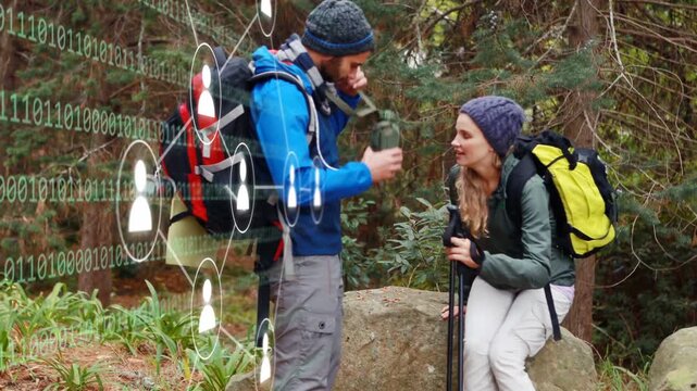 Couple hiking man pausing getting flask pouring drink warming she taking binary overlay forest tech
