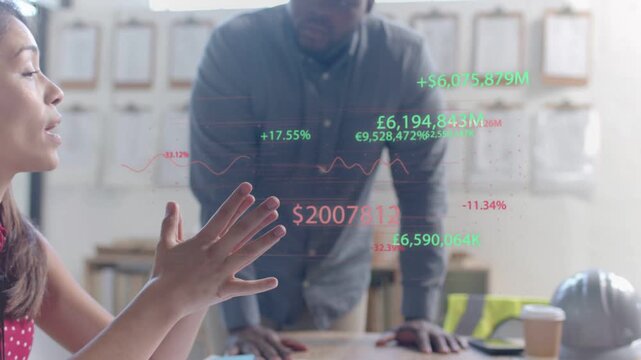 Left woman gesturing, animating floating financial overlay with numbers and graphs, guiding team
