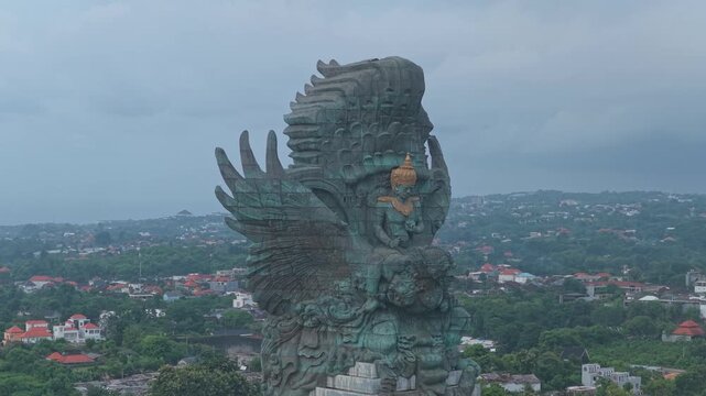 Revealing aerial shot of the garuda wisnu kencana statue in bali