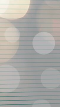Vertical video: Ruled page showing camera shift causing bokeh drift, pink flash, settling for focus