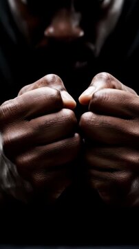 Close up shot of a man's hands aggressively clenching into tight, shaking fists, knuckles turning white from intense anger and psychological frustration, harsh high-contrast moody lighting, 4k.