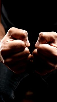 Close up shot of a man's hands aggressively clenching into tight, shaking fists, knuckles turning white from intense anger and psychological frustration, harsh high-contrast moody lighting, 4k.