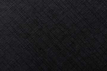 Fototapeta premium Black Grid Fabric Texture Background with Fine Ribbed Pattern,Macro,High-resolution macro shot of a black synthetic fabric featuring a detailed horizontal ribbed pattern and subtle grid texture.