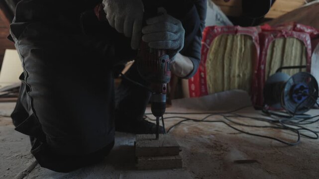 Drilling hole with drill, medium shot
