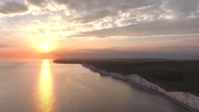 Sunset over Seven Sisters Cliffs from a drone, English Channel, East Sussex, South-east England