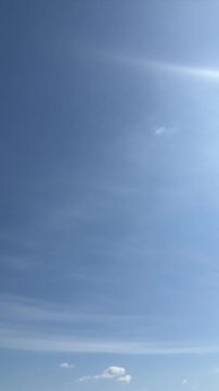 Beautiful sunny morning sky timelapse with soft fluffy clouds in clear blue peaceful atmosphere. Stock video time lapse of amazing sunny clear blue sky