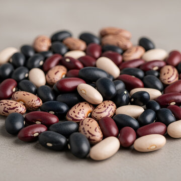 Pile of assorted beans black red white and speckled varieties.