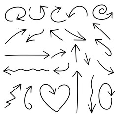 Fototapeta premium Hand-drawn doodle set of arrows on a white background.