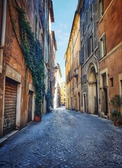 Obraz premium Narrow cobblestone street in an old Italian city with historic buildings and ivy