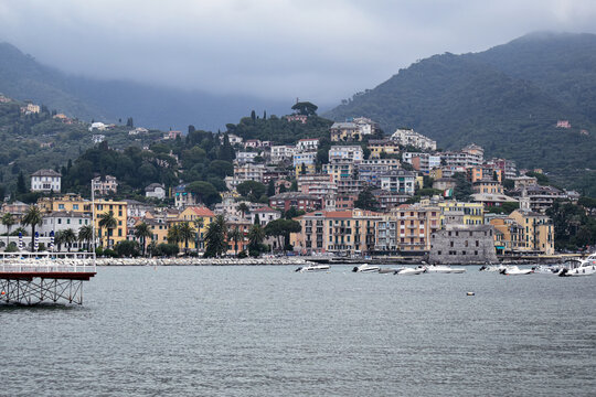 Scenic view of Rapallo, Italy, featuring calm waters and colorful historic buildings along the waterfront