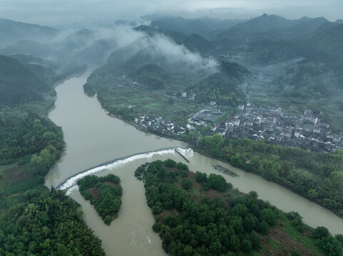 Xin'an River landscape gallery with Huizhou-style villages shrouded in morning mist and green mountains