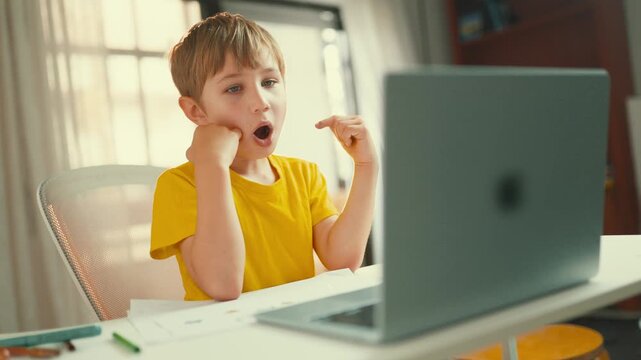 Boy participating in an online speech therapy lesson