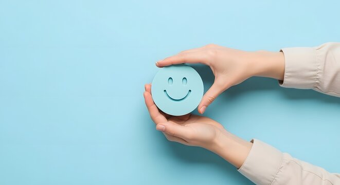 A person holding a round card with a smiley face icon, representing customer satisfaction feedback and a positive experience.