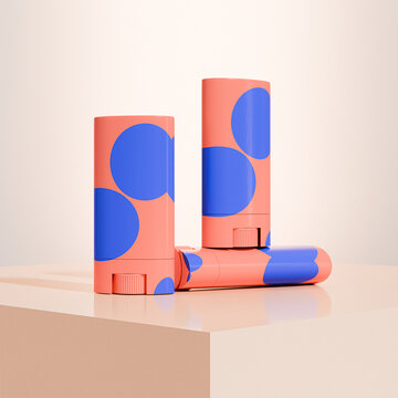 Orange twist-up cosmetic stick applicator with blue dot graphic design, soild cream blush stick mockup, Push up skincare tube plastic Packaging, Rotating solid makeup container, beauty branding