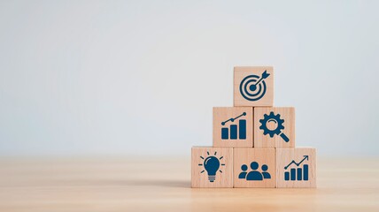 Obraz premium Business Strategy Pyramid with Icons for Goals, Teamwork, and Growth Development
