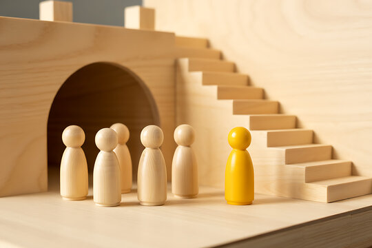 Yellow wooden figure stands apart from a group near stairs with architecture outsider different standing individuality conformity direction building structure childhood education learning