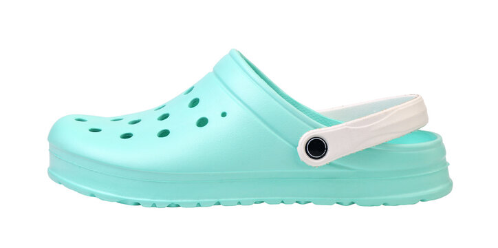 Mint green rubber clogs with white strap isolated on white background.