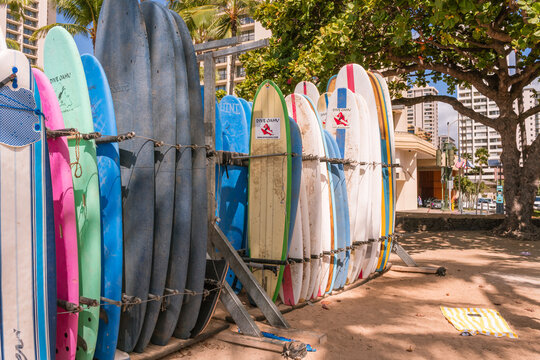 Honolulu, Oahu, HI, US-October 29, 2023: Rows of surfboards for rent on the famous Waikiki Beach. 