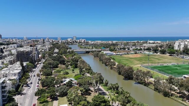 Aerial 4K view of Yarkon Park, green urban oasis and river in Tel Aviv, Israel