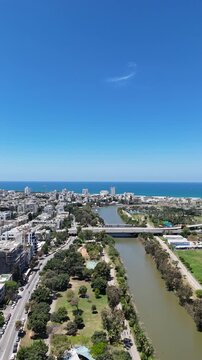 Aerial 4K view of Yarkon Park, green urban oasis and river in Tel Aviv, Israel