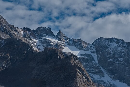 Russia. Kabardino-Balkaria. View of the snow-capped peaks of the Caucasus Mountains at sunset on an autumn day.
