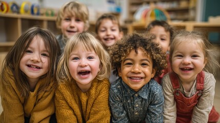 Fototapeta premium Group of diverse happy preschool children smiling together in a classroom